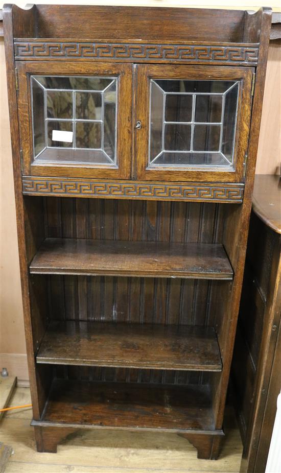 An oak open bookcase with glazed top W.61cm